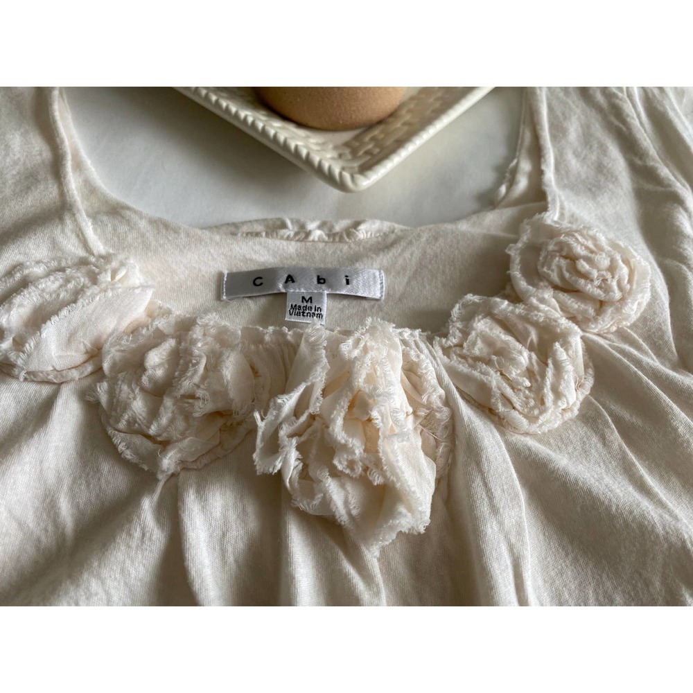 Ivory Knit Top by CAbi Medium Cap Sleeves Rosette Accented Neckline Bubble Hem